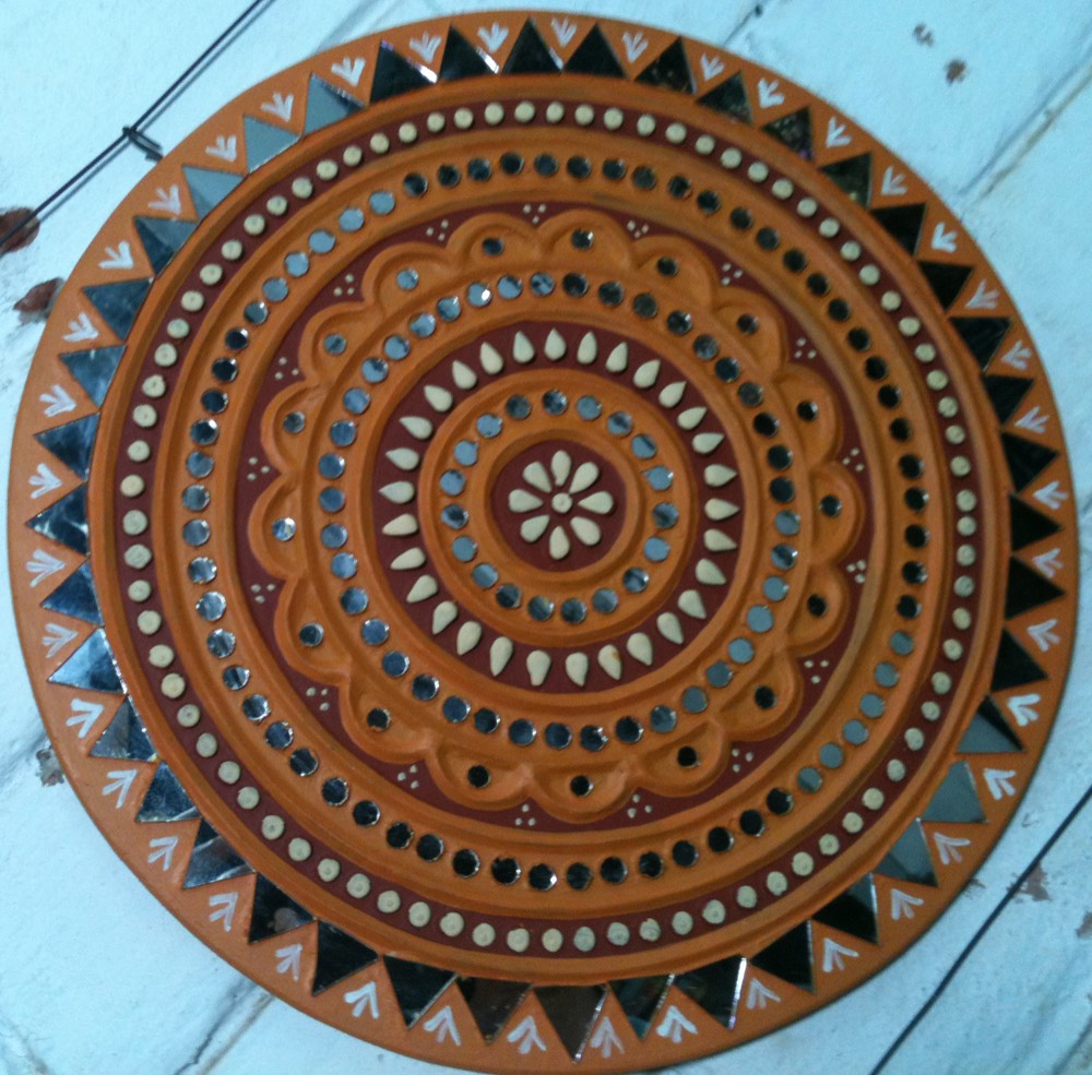 Blue mud art with red design