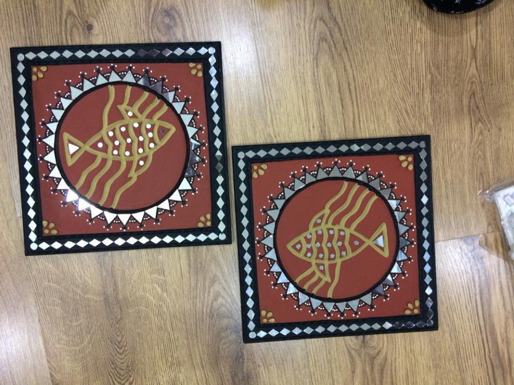 Red two mud art with fish design