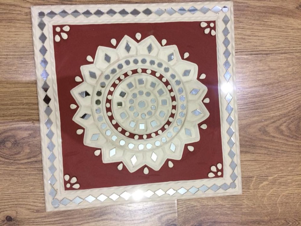 Square mud art with design red and white